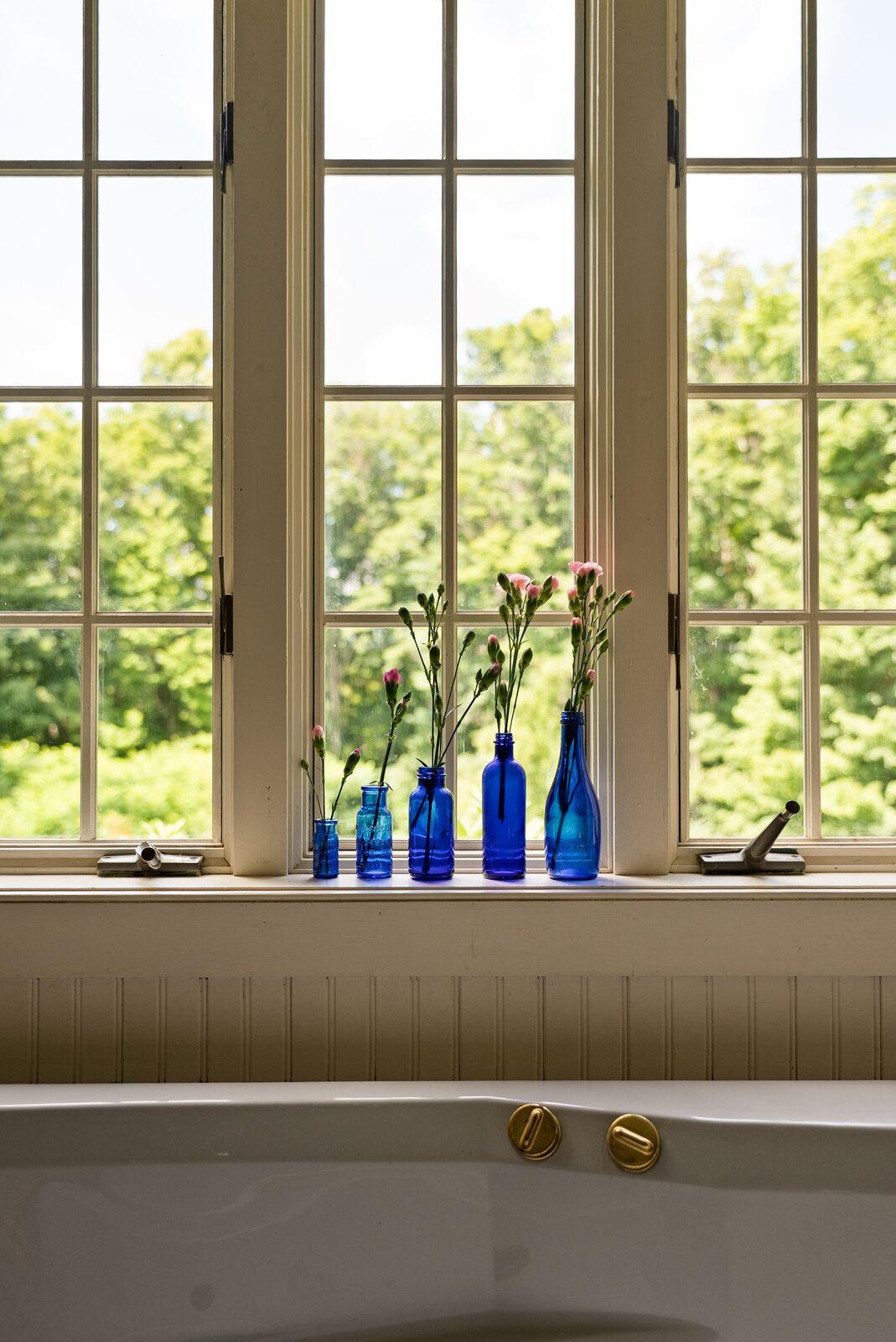 The window above the tub, beadboard and sill
