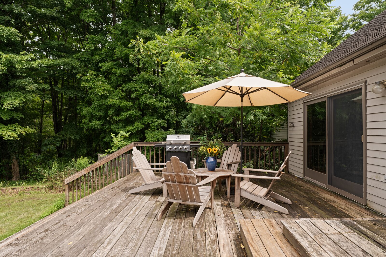 The deck off the main level, open to the clearing
