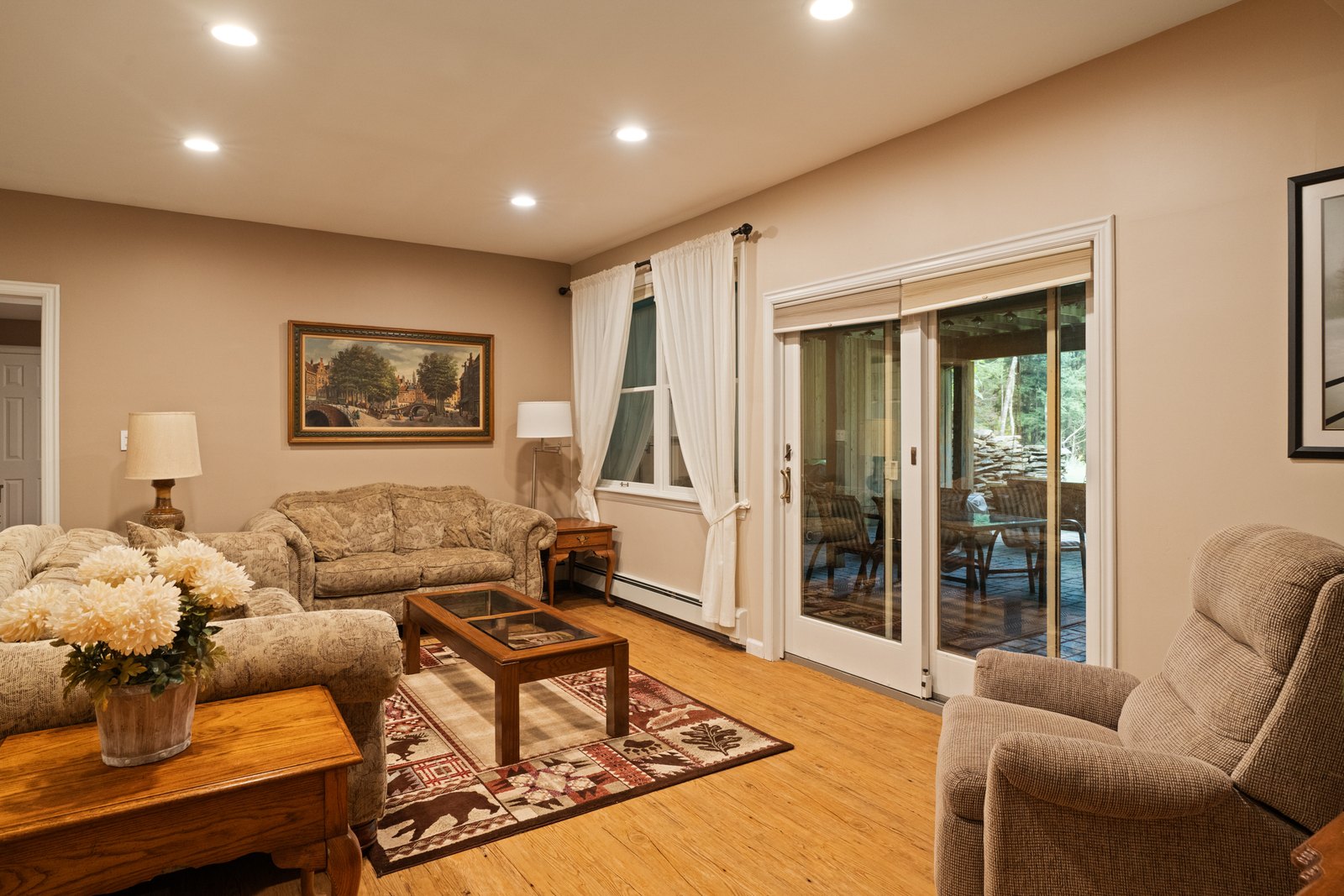 A lower-level living room with sliding doors to the outside.